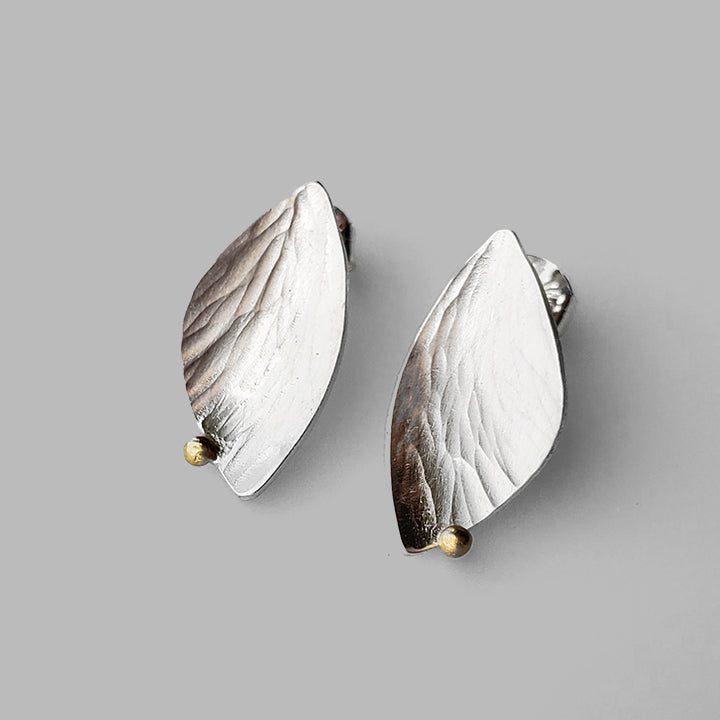 wing shaped textured silver posts with gold dots