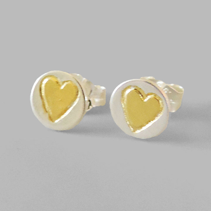 round silver posts with gold hearts