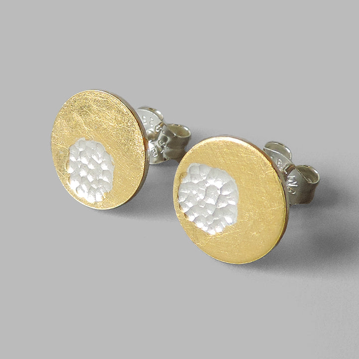 round silver posts with gold layered around hammered circle