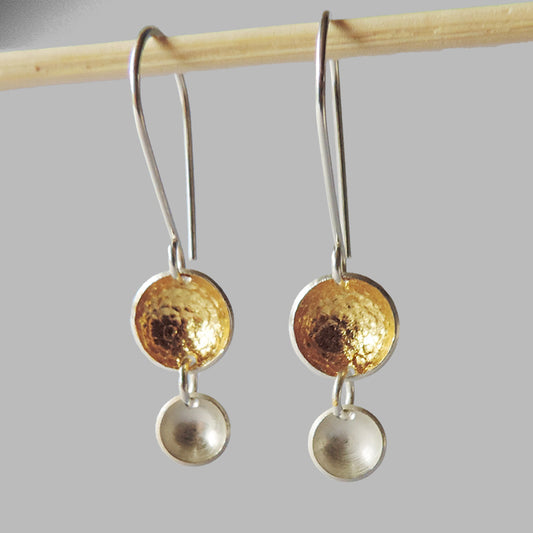 two silver graduated cups dangles large cup with hammered gold