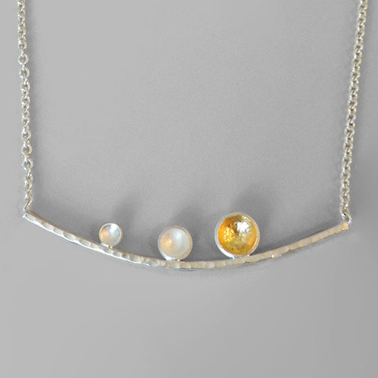 curved hammered silver bar with 3 graduated cups one hammered with gold on chain