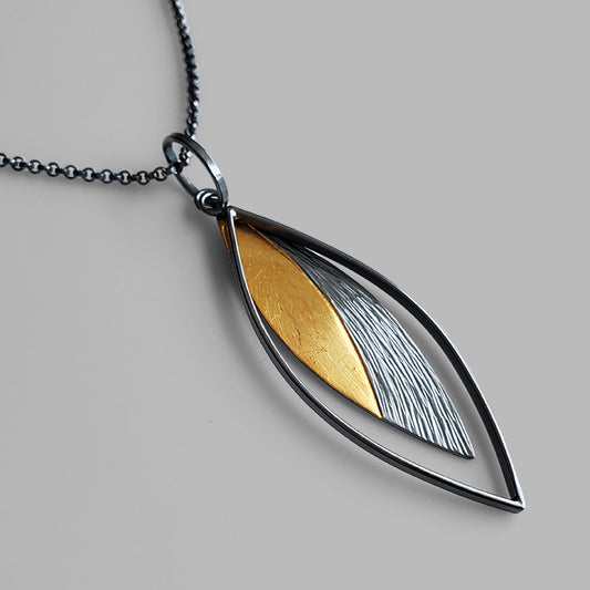 leaf shaped oxidized silver and gold pendant