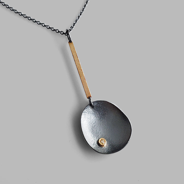 handcrafted silver and gold organic pendant with diamond oxidized silver