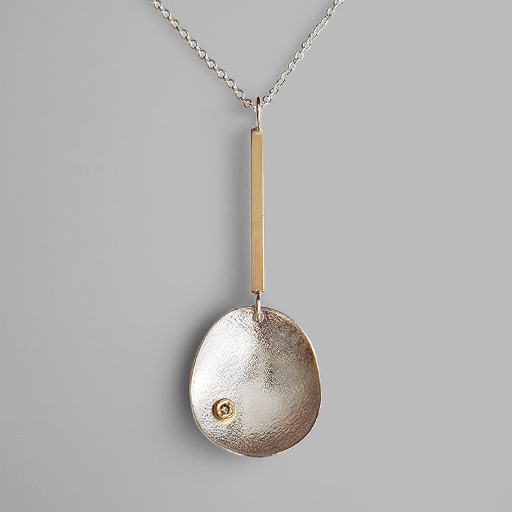 handmade silver and gold necklace organic shaped pendant with diamond