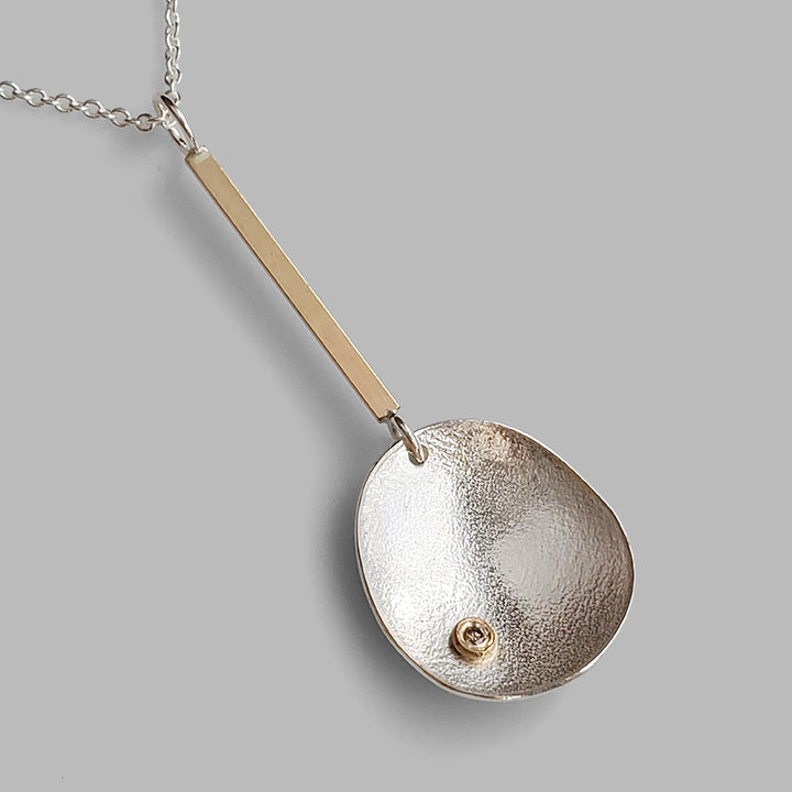 handmade organic silver pendant with diamond on gold bar 18 inch chain