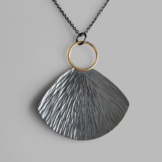 oxidized silver and gold fan shaped textured necklace