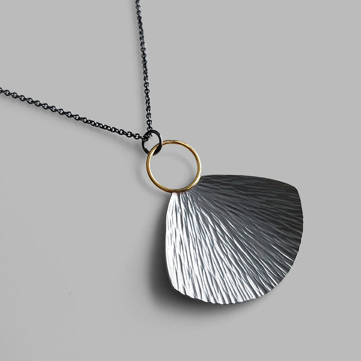 oxidized silver and gold fan shaped textured necklace