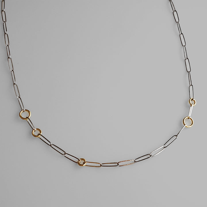 simple minimal silver chain with small round gold hoops