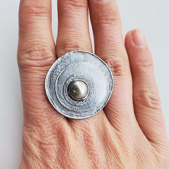 large round oxidized silver textured layered circles with grey round pearl