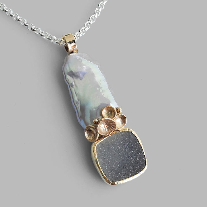 grey rectangle organic pearl with gold cups and white sparkly square stone set in gold bezel on silver chain