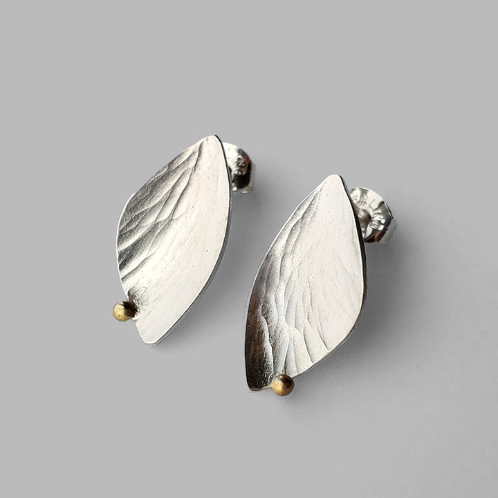 wing shaped silver textured posts with gold dot