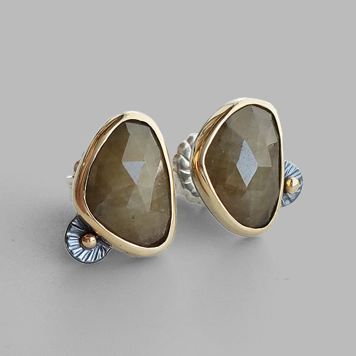 dark yellow rose cut gemstones set in yellow gold with textured silver accents