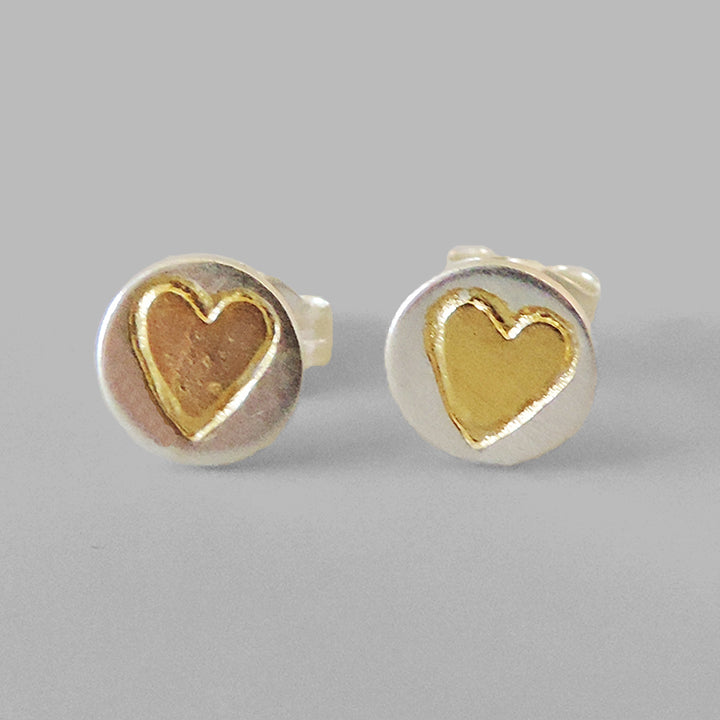 round silver posts with gold hearts