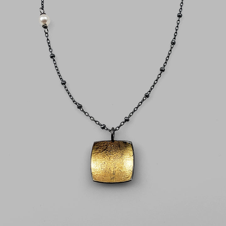 square oxidized silver and gold pendant on chain with pearl