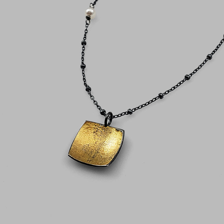 square oxidized silver and gold pendant on chain with pearl