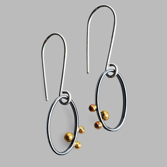 oval oxidized silver small silver hoops with three gold dots