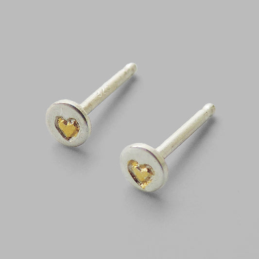 small round silver posts with gold heart