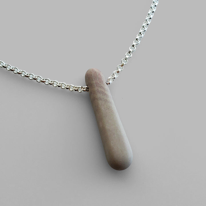 grey pink stick shaped stone on silver chain